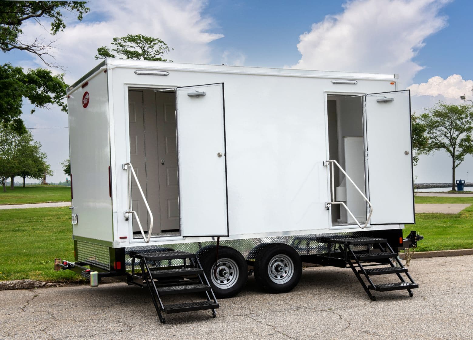 Luxury restroom trailer set up at an outdoor wedding venue in Canada